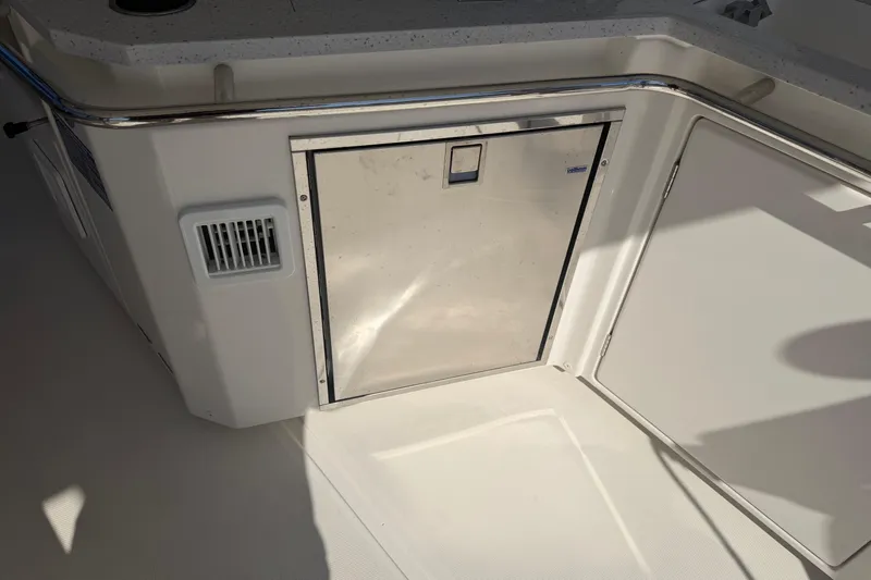 Chasin' Hyde Yacht Photos Pics Aquila 36 Sport 2023 boat interior with stainless steel storage compartment.