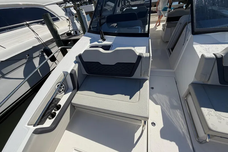 Chasin' Hyde Yacht Photos Pics 2023 Aquila 36 Sport boat interior with seating and cup holders.