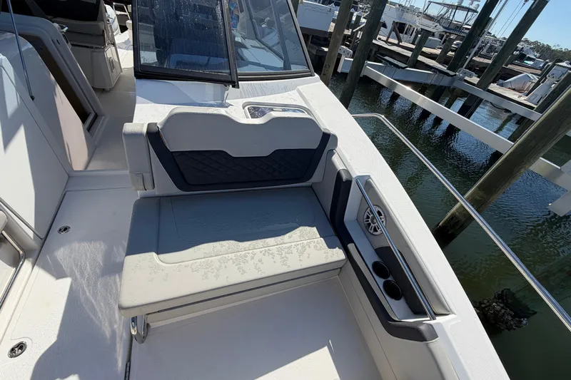 Chasin' Hyde Yacht Photos Pics 2023 Aquila 36 Sport boat interior with cushioned seating and cup holders.