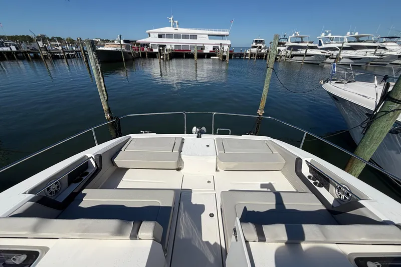 Chasin' Hyde Yacht Photos Pics 2023 Aquila 36 Sport yacht docked at marina with spacious seating area.