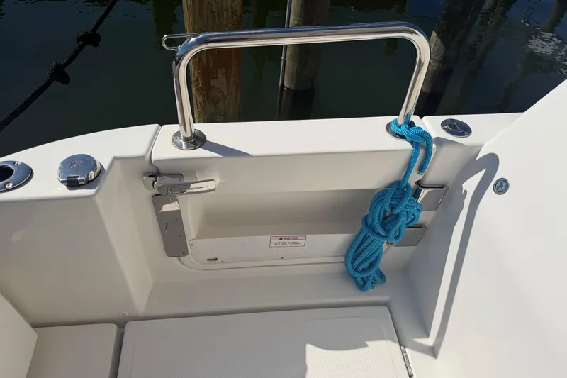 Chasin' Hyde Yacht Photos Pics 2023 Aquila 36 Sport boat deck with blue rope and stainless steel railing.