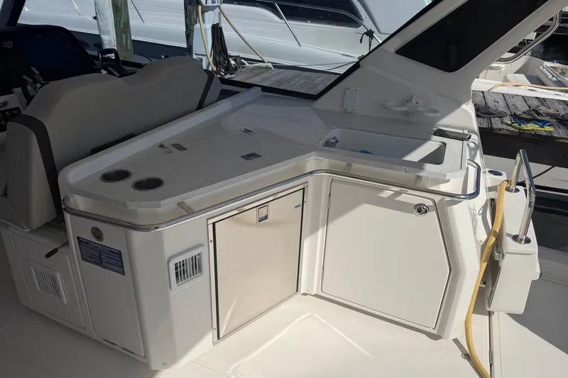 Chasin' Hyde Yacht Photos Pics 2023 Aquila 36 Sport yacht interior with kitchenette and seating area.