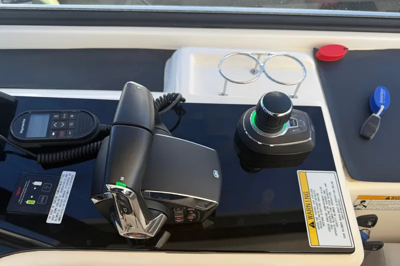 Chasin' Hyde Yacht Photos Pics Control panel of 2023 Aquila 36 Sport boat with joystick and throttle controls.