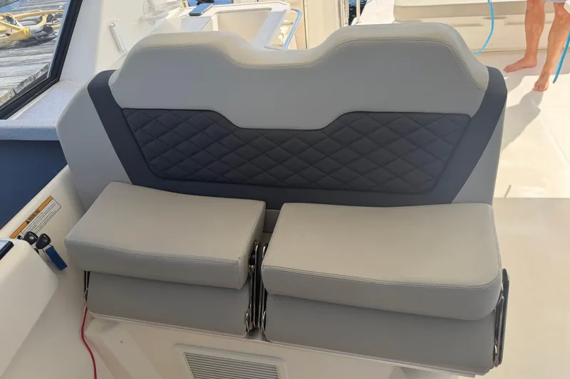 Chasin' Hyde Yacht Photos Pics Gray leather seating on 2023 Aquila 36 Sport boat, featuring quilted backrest design.
