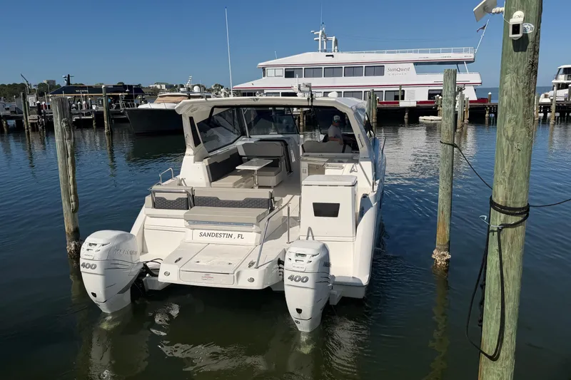 Chasin' Hyde Yacht Photos Pics 2023 Aquila 36 Sport boat docked in Sandestin, Florida marina.
