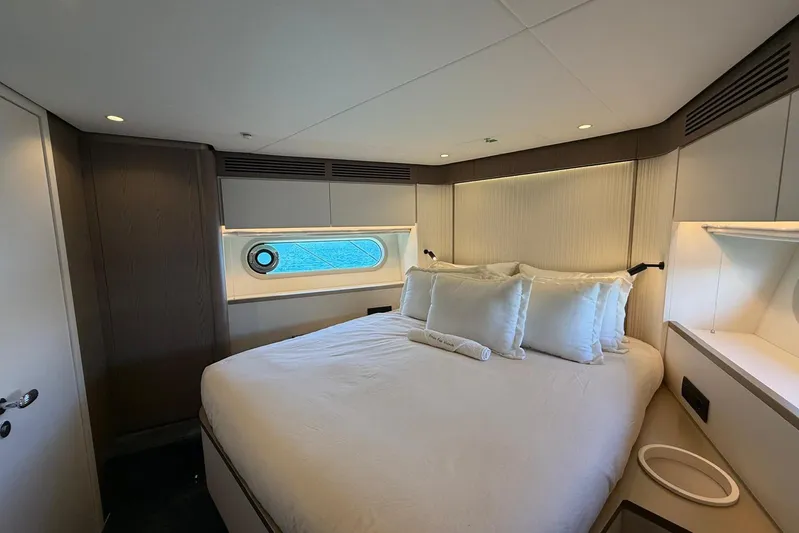 Dolce Far Niente Yacht Photos Pics Luxurious bedroom interior of 2024 Azimut Magellano 60 yacht with modern design.