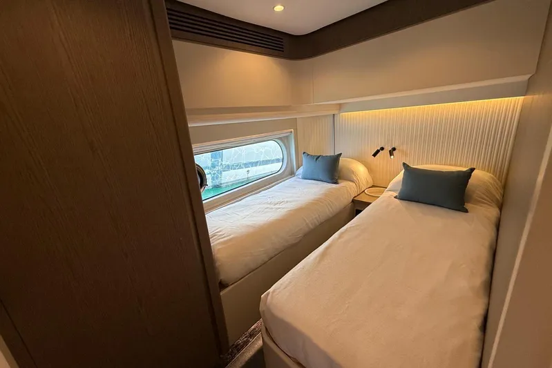 Dolce Far Niente Yacht Photos Pics 2024 Azimut Magellano 60 yacht cabin with twin beds and modern decor.