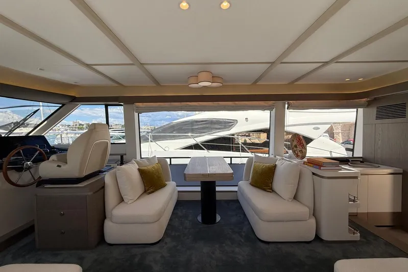 Dolce Far Niente Yacht Photos Pics Luxurious interior of 2024 Azimut Magellano 60 yacht with elegant seating and dining area.
