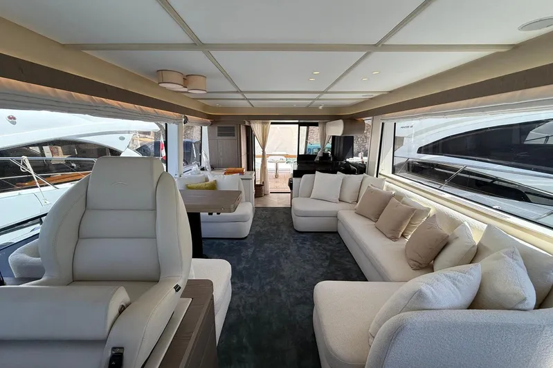 Dolce Far Niente Yacht Photos Pics Luxurious interior of 2024 Azimut Magellano 60 yacht with plush seating and modern design.