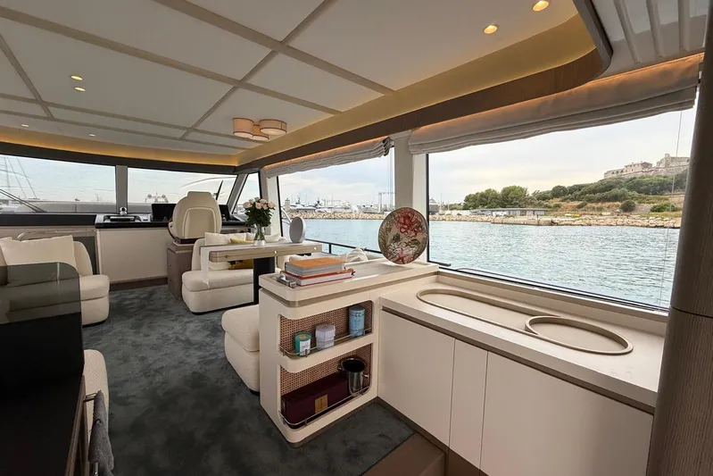 Dolce Far Niente Yacht Photos Pics Luxurious interior of 2024 Azimut Magellano 60 yacht with scenic water view.