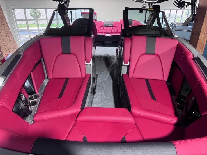  Yacht Photos Pics 2025 MasterCraft X24 boat interior with vibrant red seating and modern design.