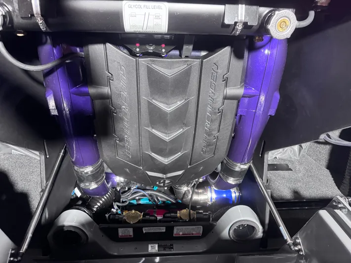  Yacht Photos Pics 2025 MasterCraft X24 engine with purple components and sleek design.