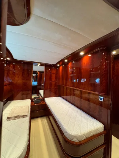  Yacht Photos Pics Luxurious cabin interior of 2003 Astondoa 82 yacht with twin beds and elegant wood finish.