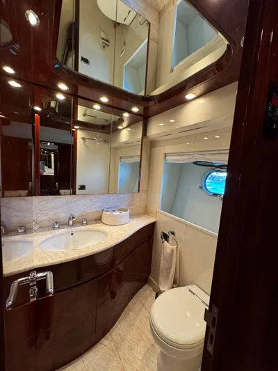  Yacht Photos Pics Luxurious bathroom in 2003 Astondoa 82 yacht with elegant fixtures and mirrored cabinets.