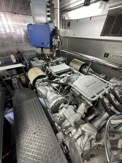  Yacht Photos Pics Engine room of a 2003 Astondoa 82 yacht, showcasing mechanical components and systems.