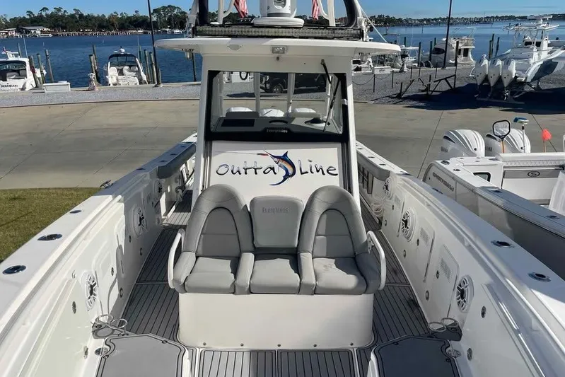 Outta Line Yacht Photos Pics 2013 Everglades 355 Center Console boat docked by the waterfront.