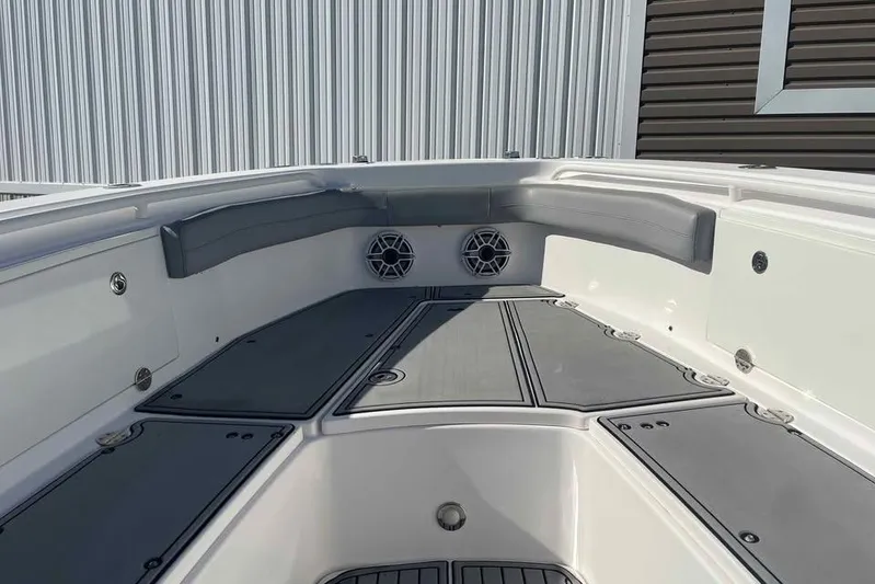 Outta Line Yacht Photos Pics 2013 Everglades 355 Center Console boat interior with seating and speakers.