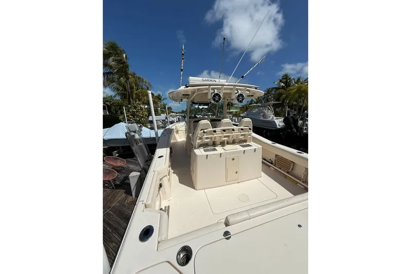  Yacht Photos Pics 2021 Grady-White Canyon 336 boat docked under clear blue sky.