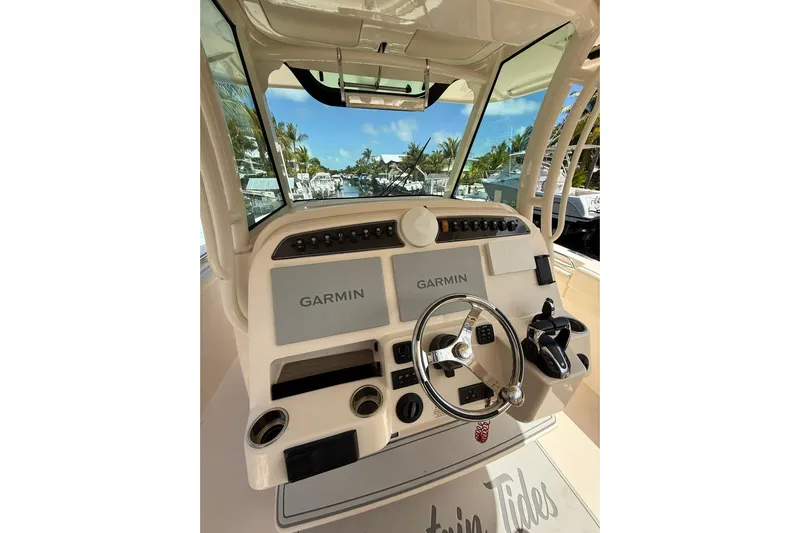  Yacht Photos Pics 2021 Grady-White Canyon 336 helm with Garmin displays and steering wheel.