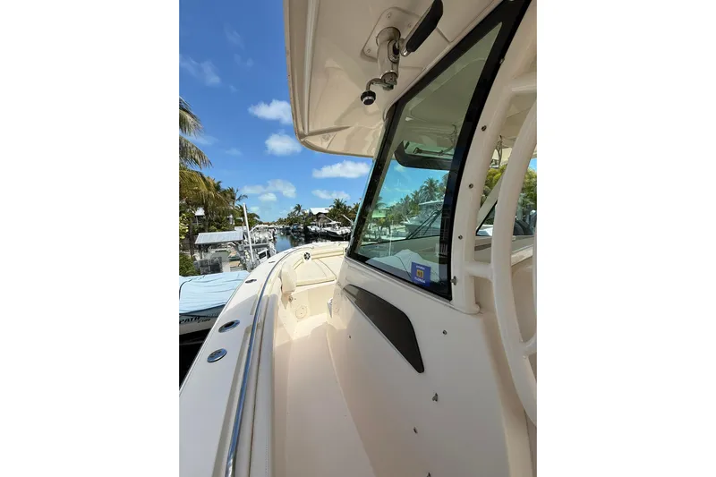  Yacht Photos Pics 2021 Grady-White Canyon 336 boat docked under clear blue sky.