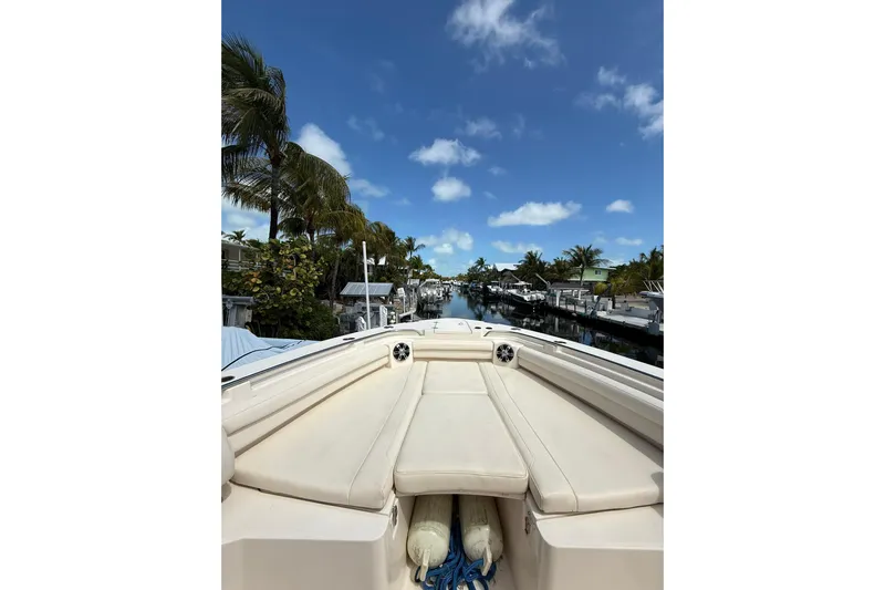  Yacht Photos Pics 2021 Grady-White Canyon 336 boat docked under clear blue sky.