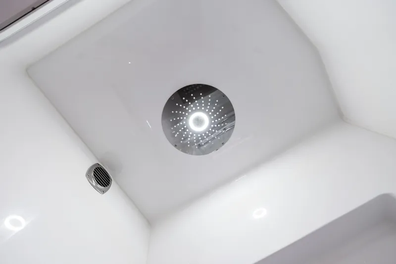  Yacht Photos Pics Ceiling view of 2025 HCB 56 Suenos GIX yacht interior with modern lighting.