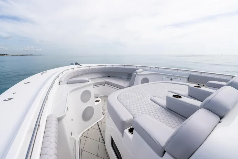  Yacht Photos Pics Luxurious 2025 HCB 56 Suenos GIX yacht interior with plush seating and ocean view.