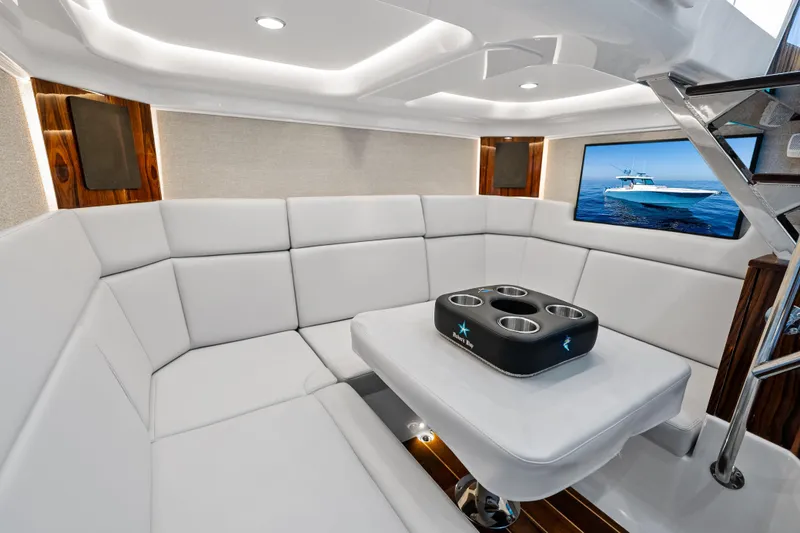  Yacht Photos Pics Luxurious interior of 2025 HCB 56 Suenos GIX yacht with plush seating and modern decor.