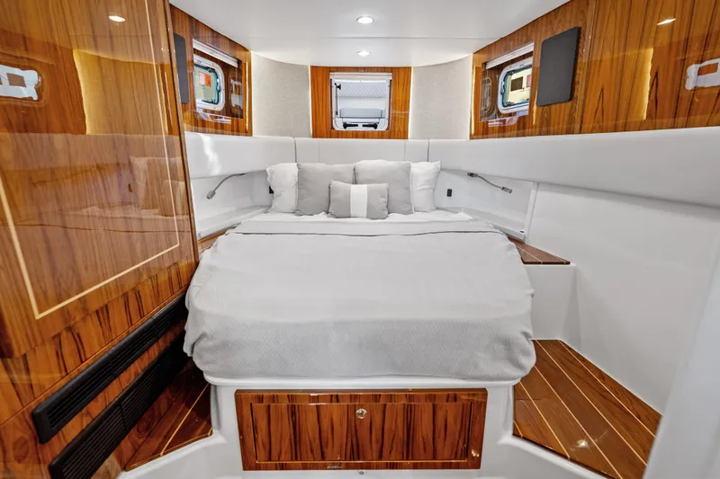  Yacht Photos Pics Luxurious cabin interior of 2025 HCB 56 Suenos GIX with elegant wood finish.