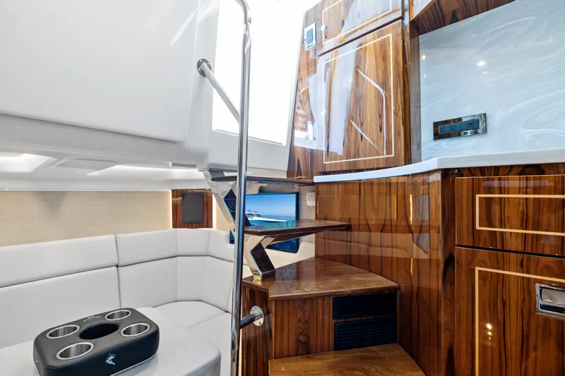  Yacht Photos Pics Luxurious interior of 2025 HCB 56 Suenos GIX yacht with elegant wood finishes.