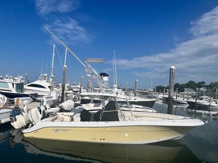 The Buck-a-neer Yacht Photos Pics 2005 Hydra-Sports Vector 3300 CC boat docked in a marina under a clear blue sky.