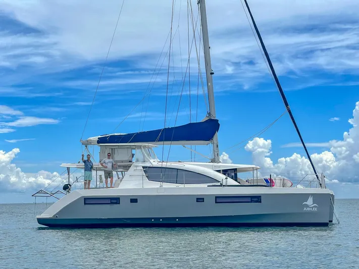 Jubilee Yacht Photos Pics Leopard 48 catamaran sailing on calm waters under a blue sky, 2015 model.