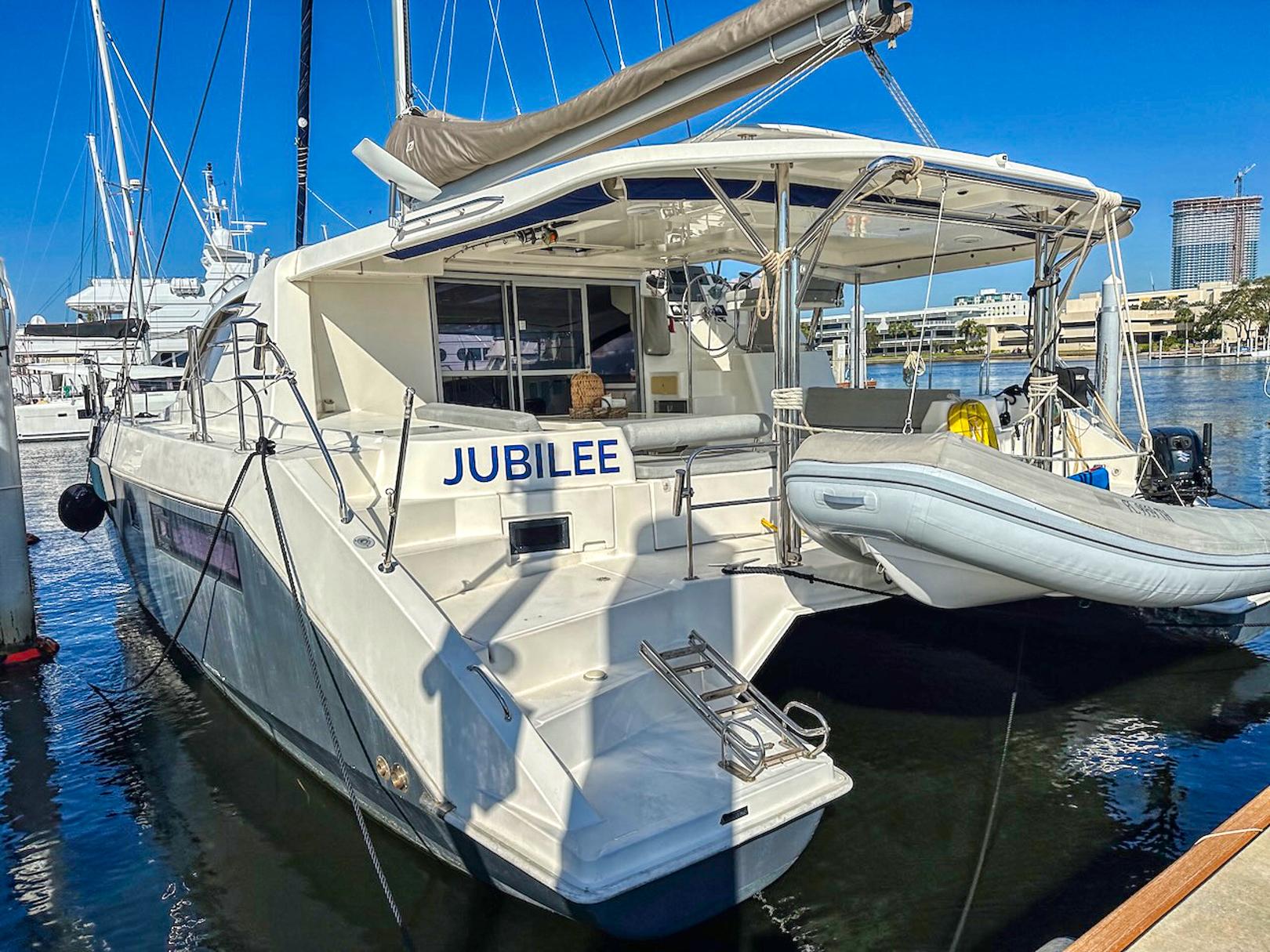 Leopard 48 catamaran named "Jubilee" docked at marina, 2015 model.
