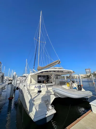 Jubilee Yacht Photos Pics Leopard 48 catamaran, 2015 model, docked with clear blue sky background.