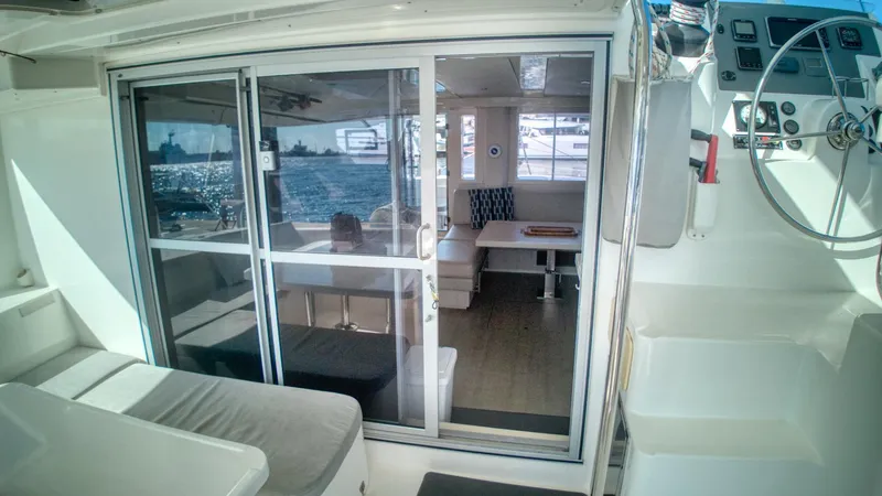 Jubilee Yacht Photos Pics Interior view of a 2015 Leopard 48 yacht, featuring a modern seating area.