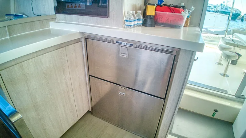 Jubilee Yacht Photos Pics Modern kitchen area on a 2015 Leopard 48 yacht with stainless steel appliances.