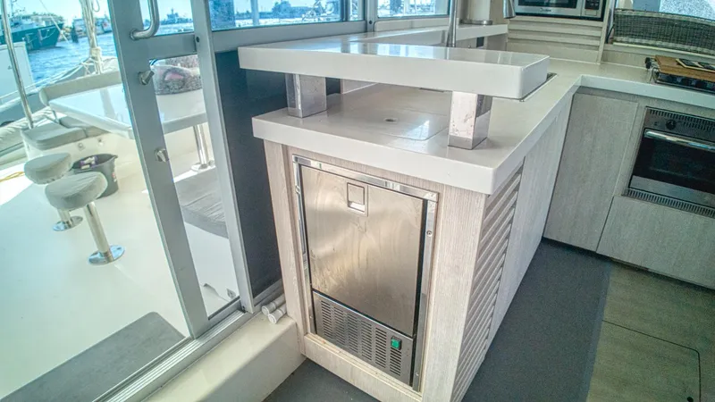 Jubilee Yacht Photos Pics Modern kitchen area on a 2015 Leopard 48 yacht with stainless steel appliances.