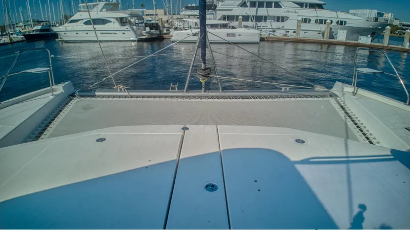 Jubilee Yacht Photos Pics Front deck view of a 2015 Leopard 48 catamaran docked at a marina.
