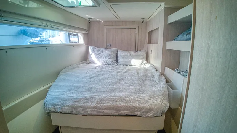Jubilee Yacht Photos Pics Cozy bedroom in 2015 Leopard 48 yacht with double bed and natural light.