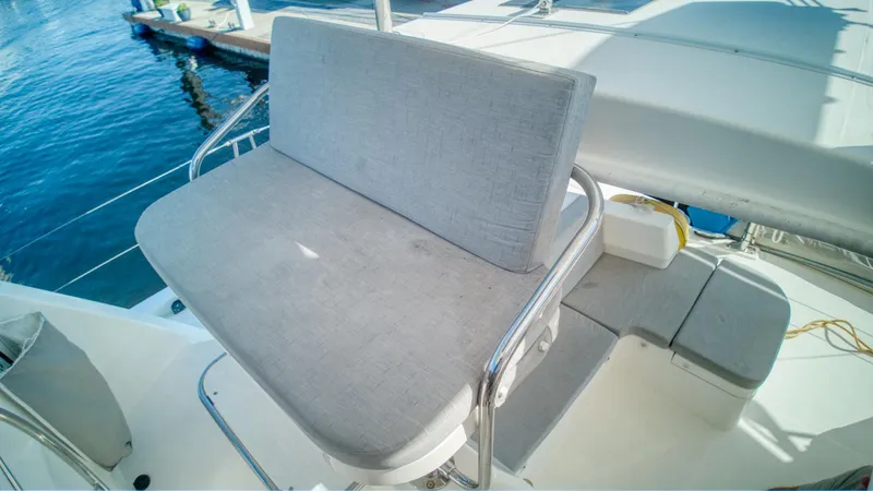 Jubilee Yacht Photos Pics Comfortable seating on 2015 Leopard 48 yacht, overlooking marina waters.