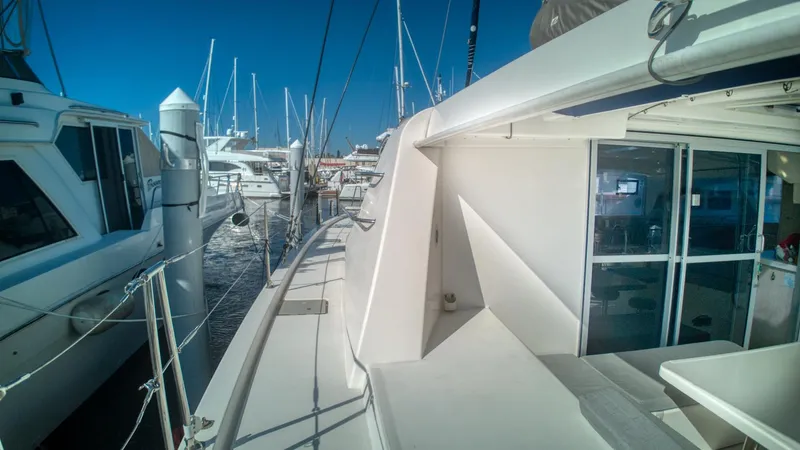 Jubilee Yacht Photos Pics Leopard 48 yacht docked at marina, surrounded by other boats, sunny day, 2015 model.