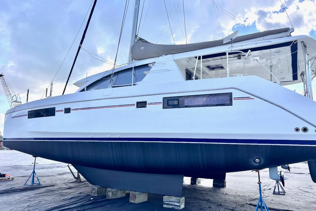 2015 Leopard 48 catamaran on dry dock, showcasing sleek design and modern features.