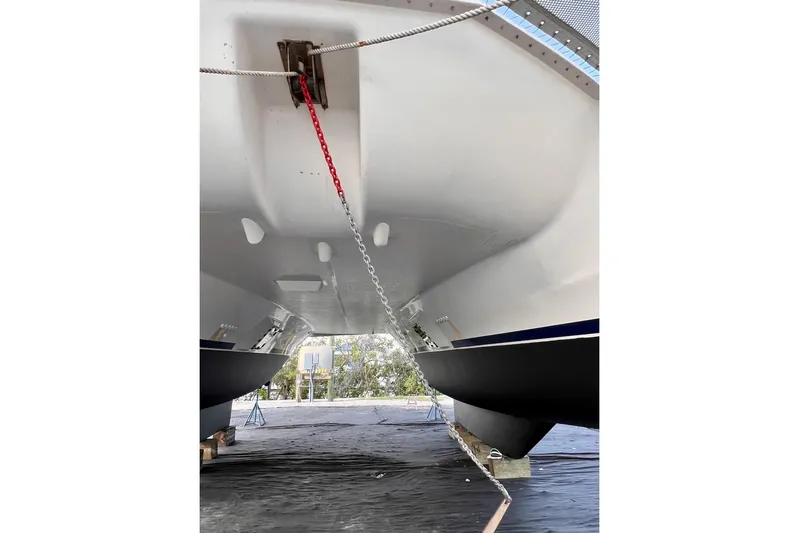 Jubilee Yacht Photos Pics Leopard 48 catamaran hull, 2015 model, secured with chains, viewed from below.