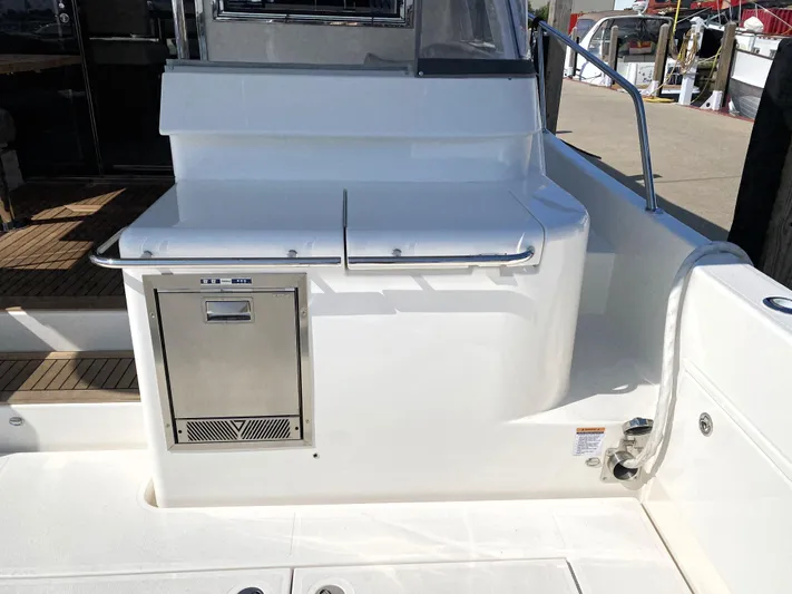  Yacht Photos Pics Riviera 465 SUV 2025 yacht deck with built-in storage and stainless steel appliance.