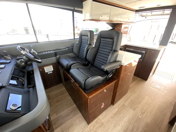 Yacht Photos Pics Interior of 2025 Riviera 465 SUV yacht with luxurious seating and modern design.