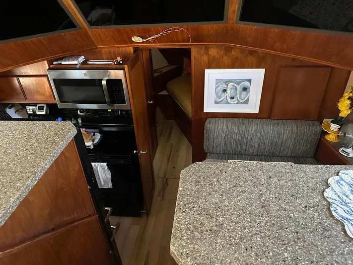 Luv'n Life Yacht Photos Pics Interior of 1989 Atlantic 47 Motor Yacht with kitchen and seating area.
