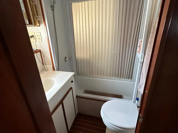 Luv'n Life Yacht Photos Pics Bathroom interior of 1989 Atlantic 47 Motor Yacht with shower and sink.