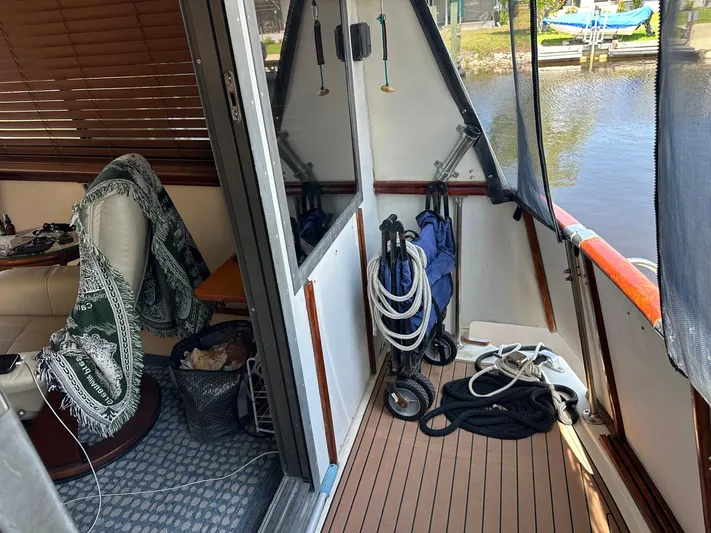 Luv'n Life Yacht Photos Pics Interior view of 1989 Atlantic 47 Motor Yacht with ropes and seating area.