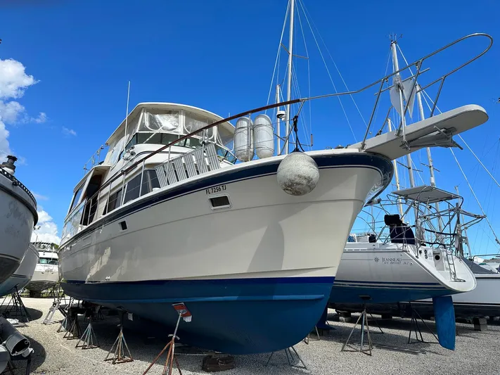 Luv'n Life Yacht Photos Pics 1989 Atlantic 47 Motor Yacht on dry dock under clear blue sky.