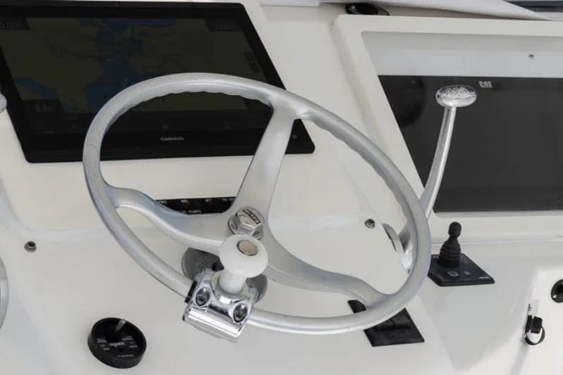  Yacht Photos Pics Steering wheel and controls of a 1999 Ocean Yachts 60 Convertible boat.